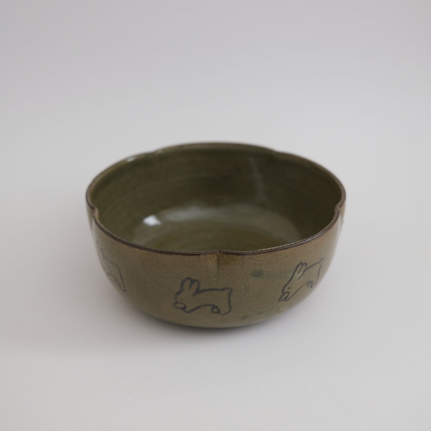 green flower bowl with bunnies