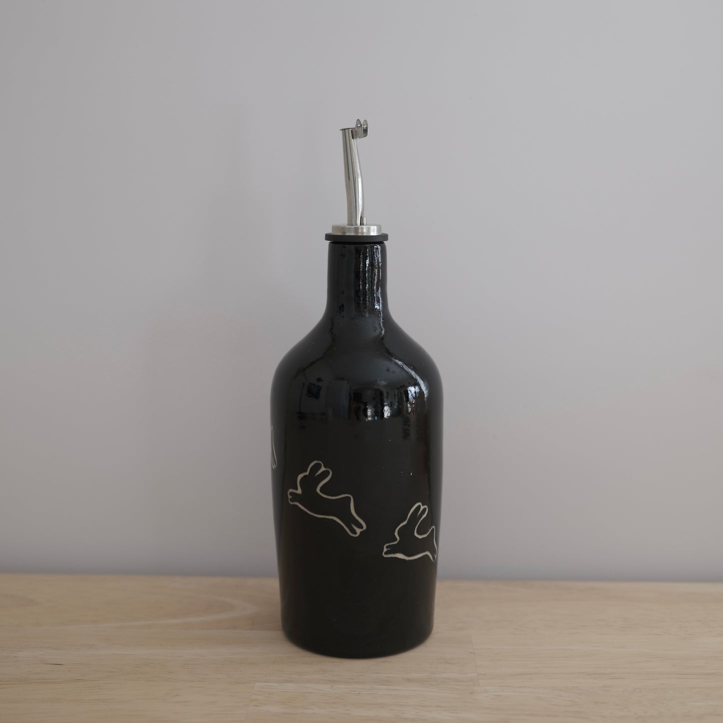 black olive oil bottle