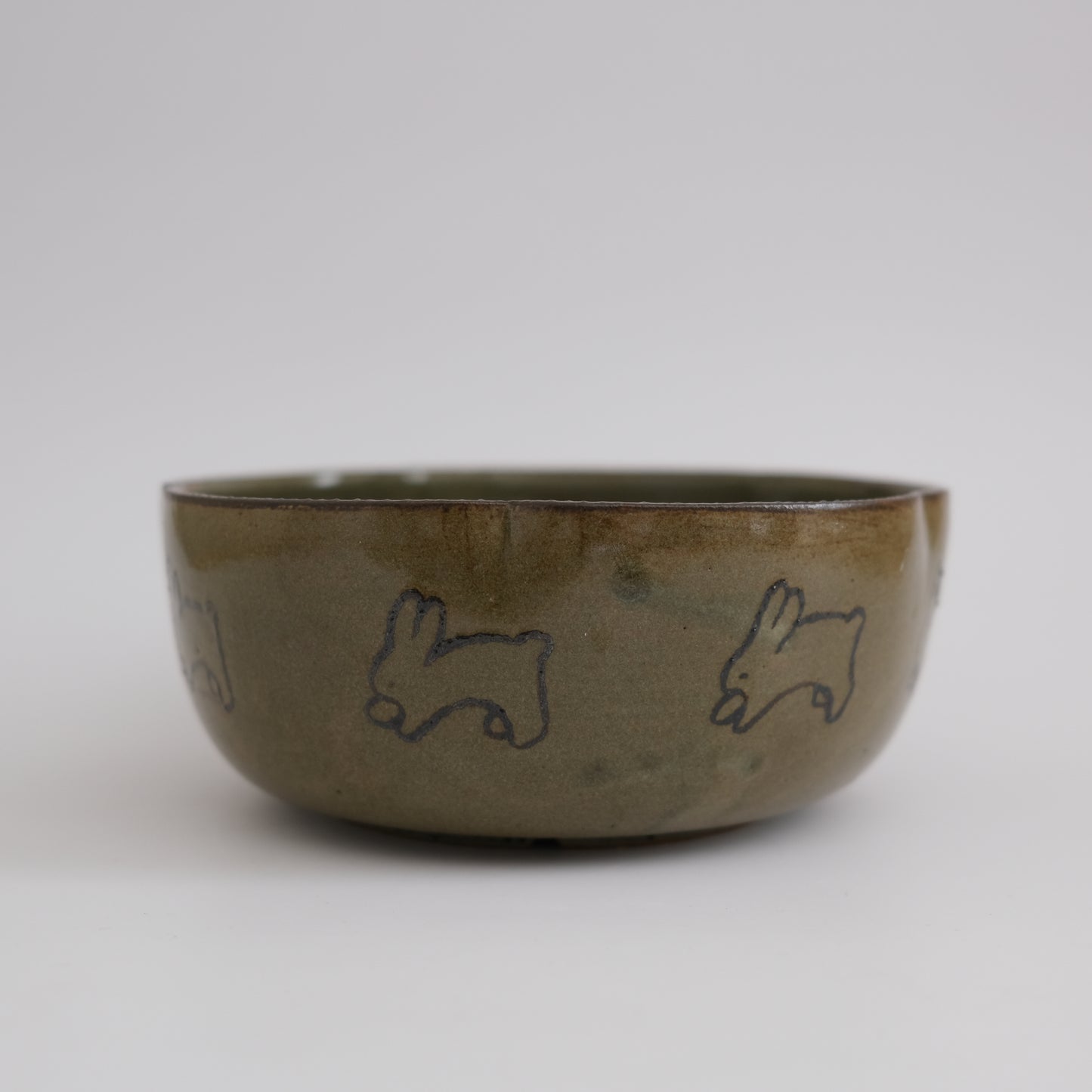 green flower bowl with bunnies