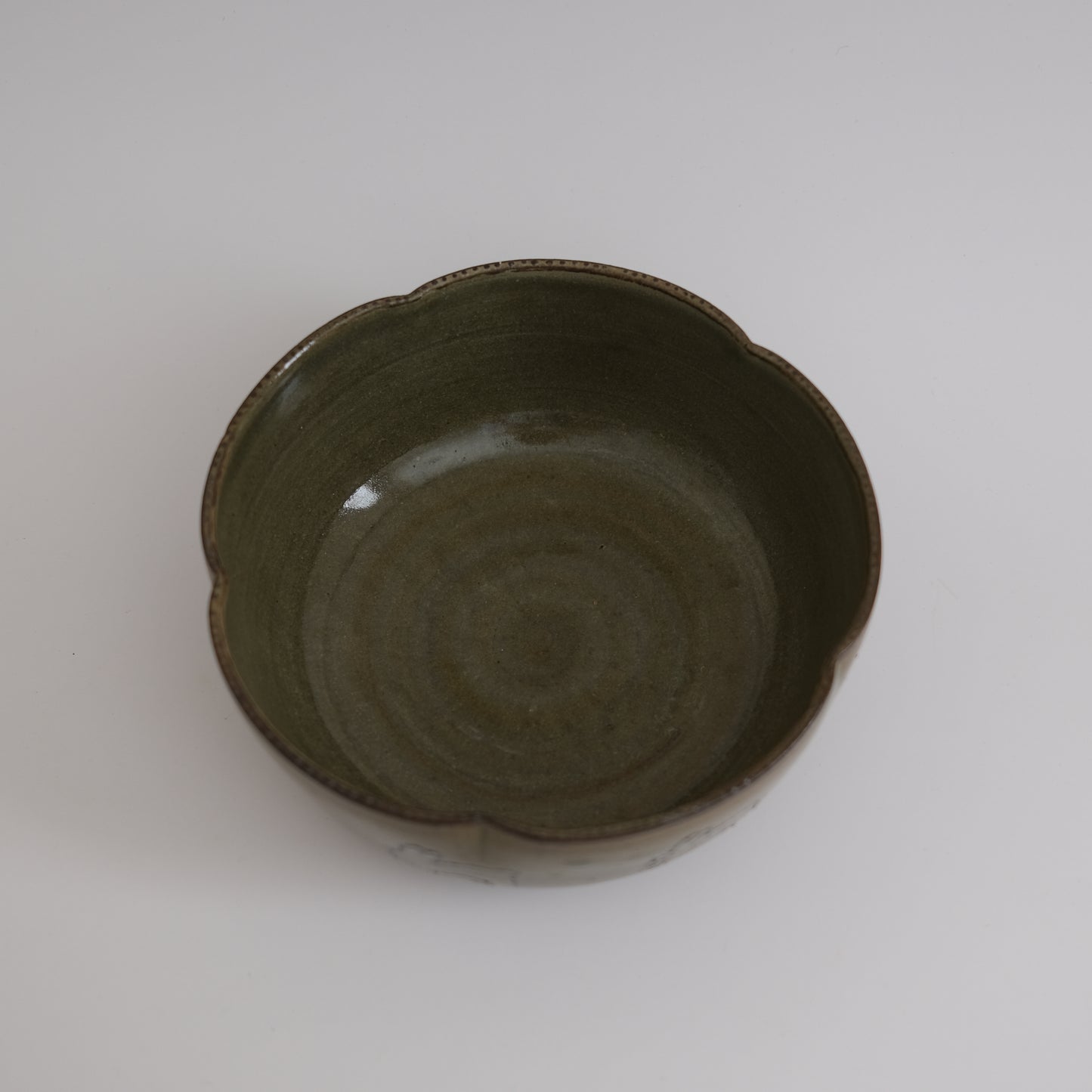 green flower bowl with bunnies